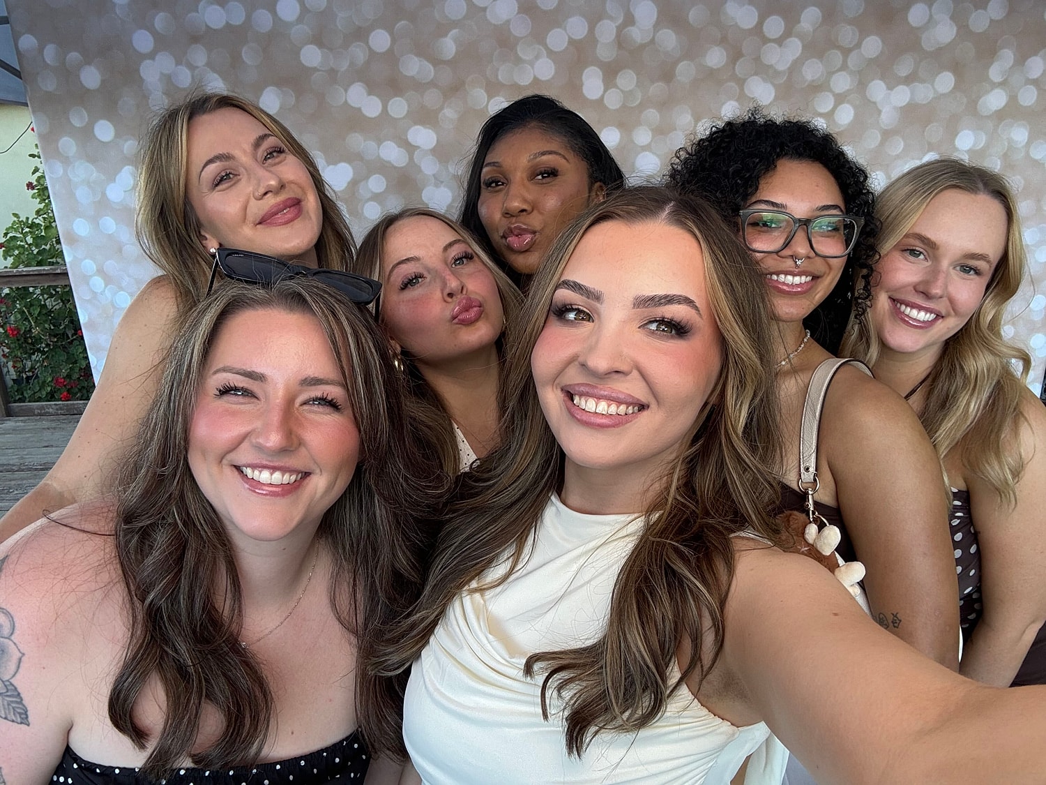 Group of smiling women posing for a selfie.