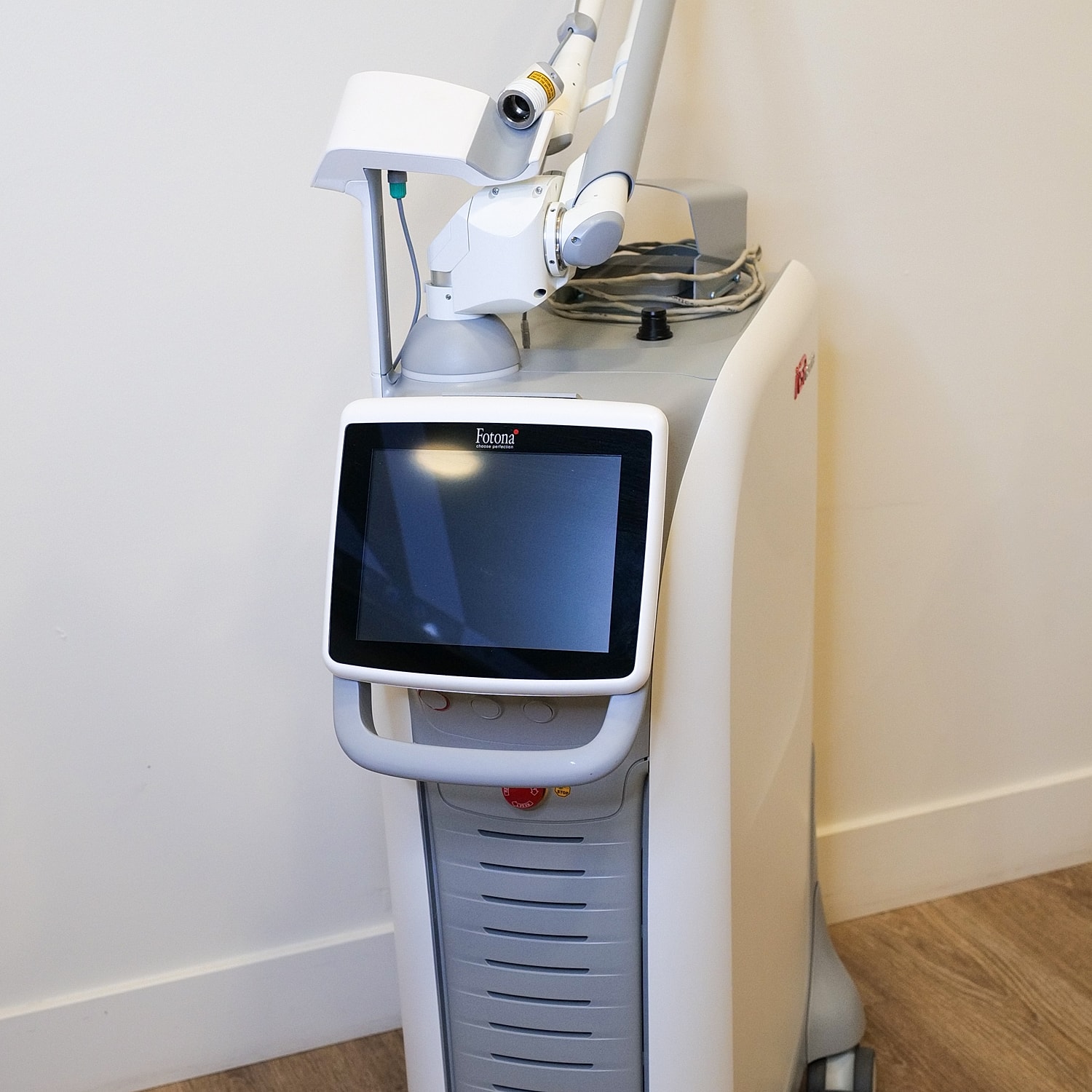 Medical laser machine with touchscreen display.
