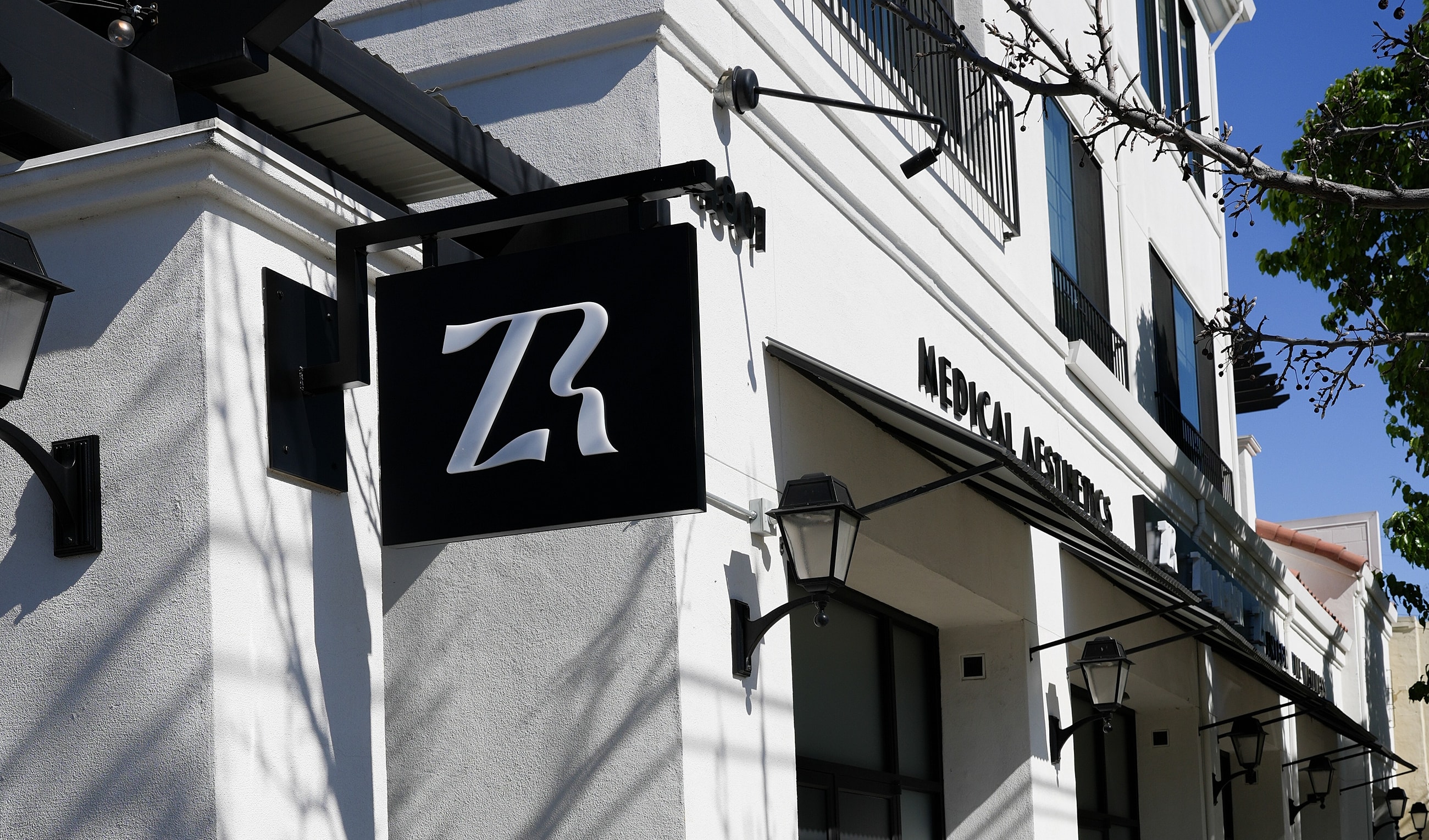 Building exterior with sign for medical aesthetics.