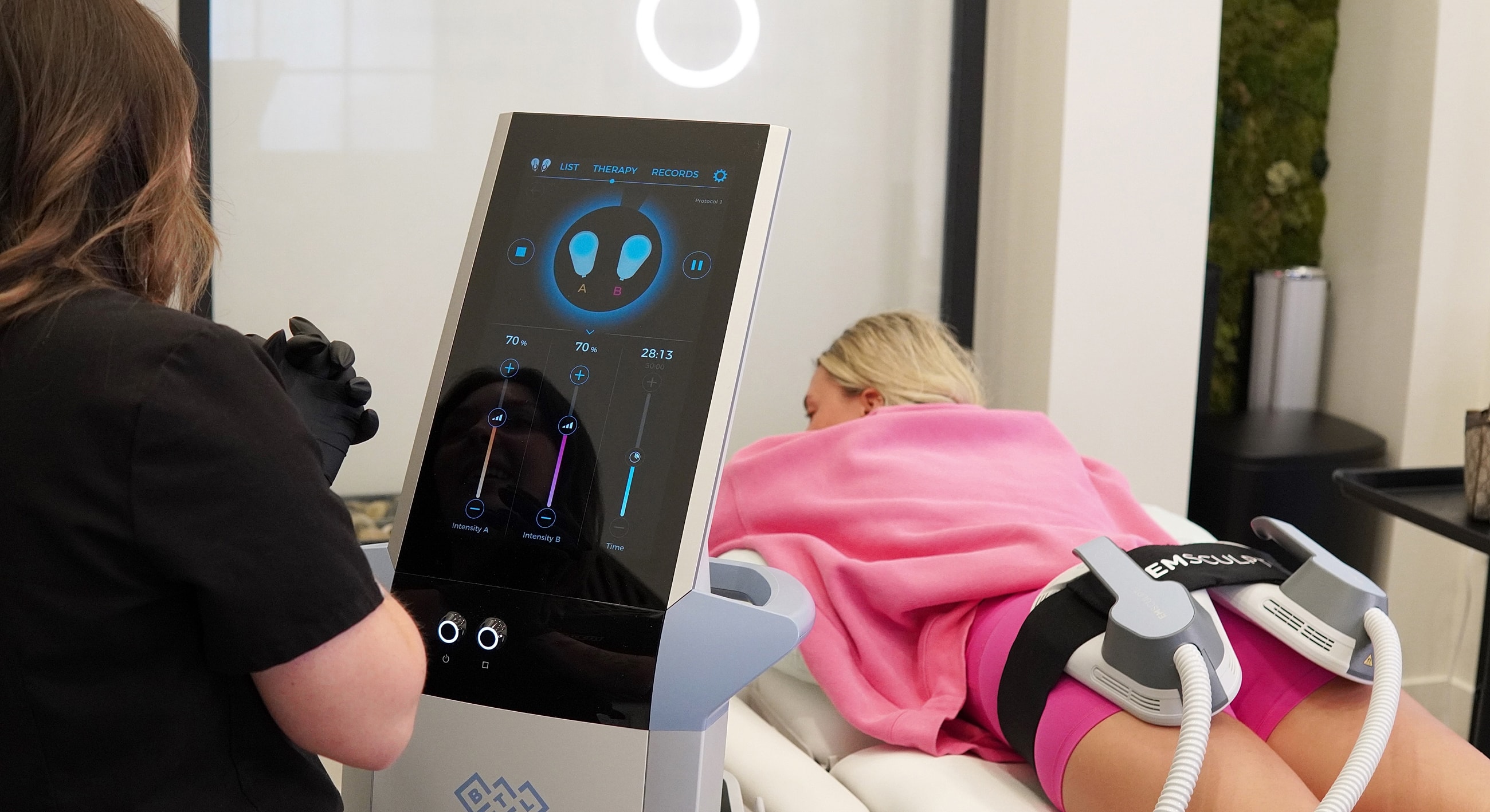 Patient receiving body contouring treatment session.