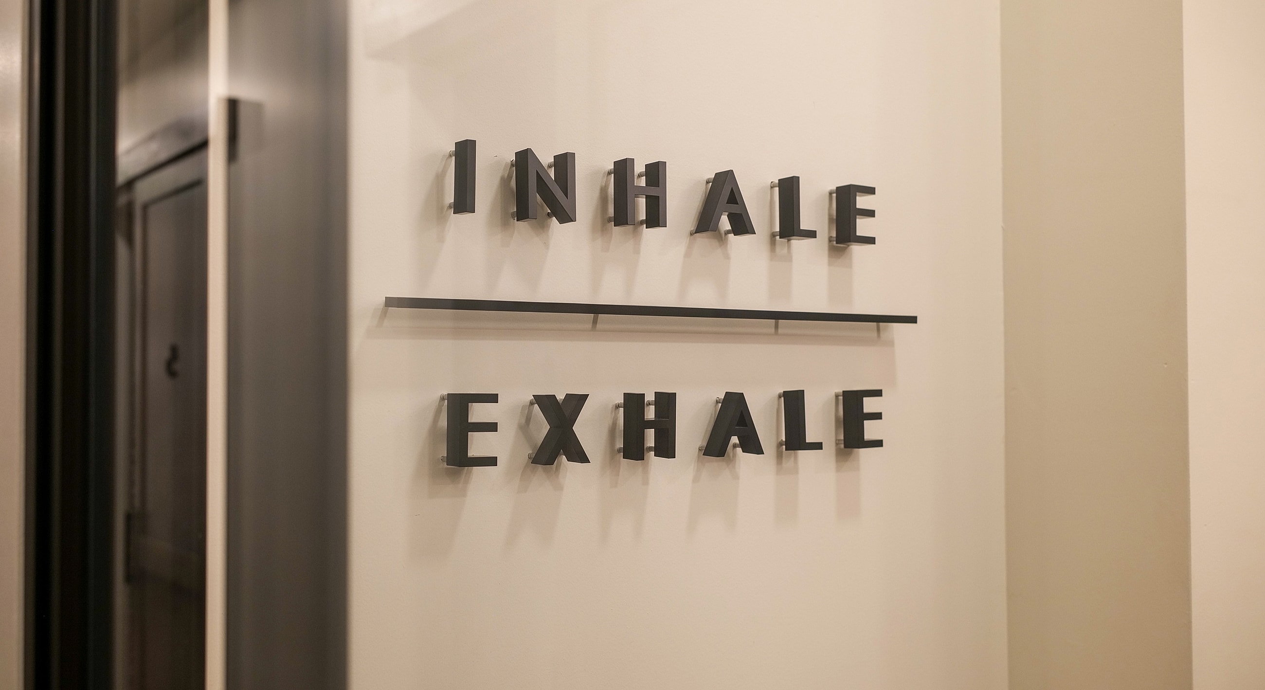 Inhale Exhale wall sign in modern design