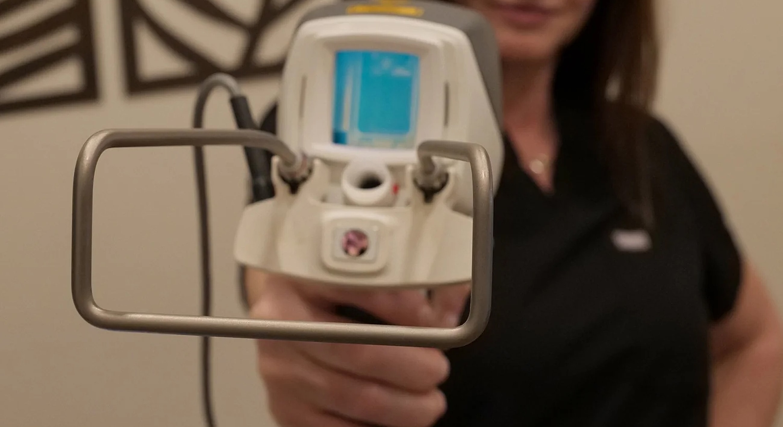 Handheld device being operated by a professional.