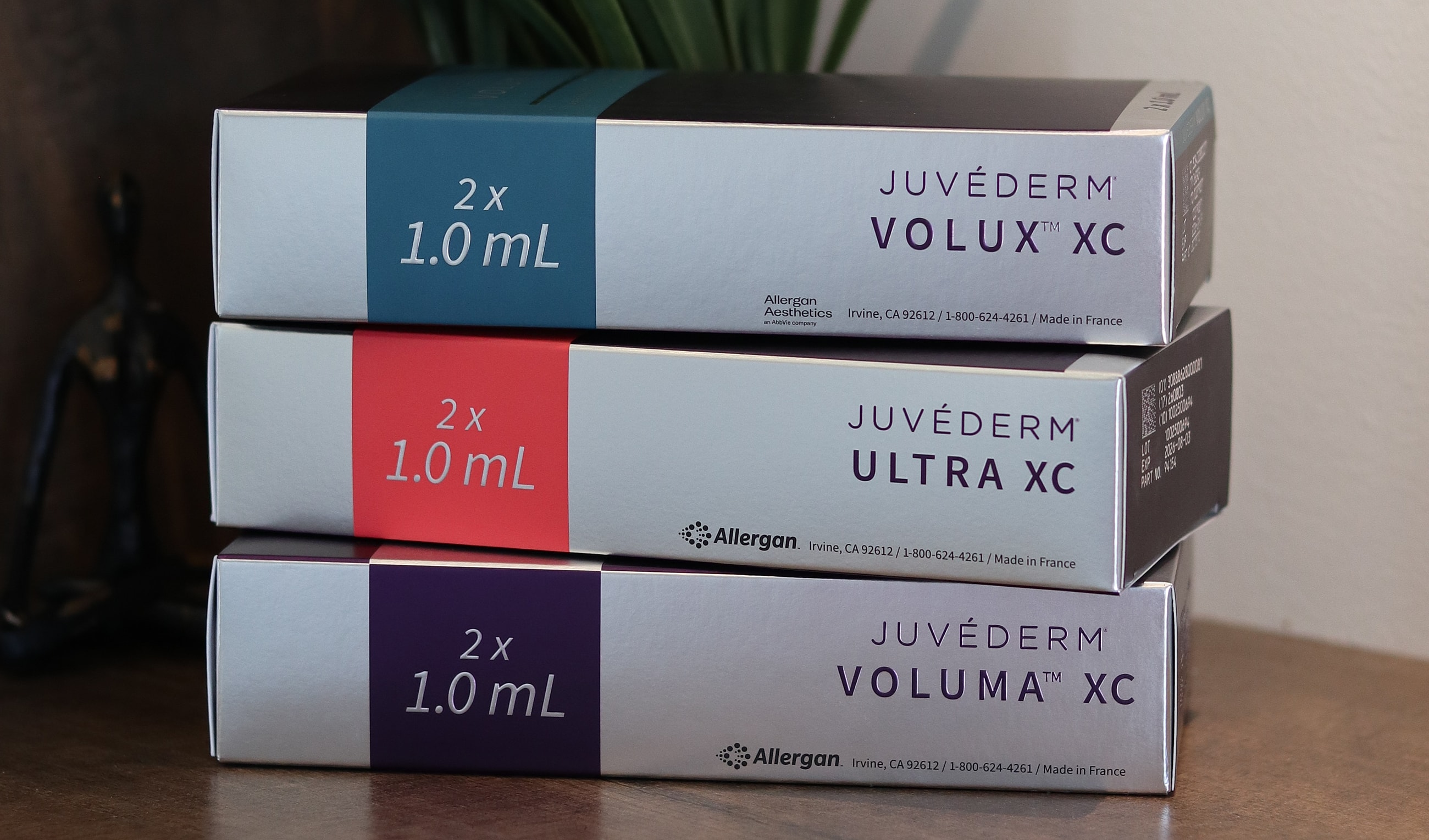 Juvéderm product boxes stacked together on table.