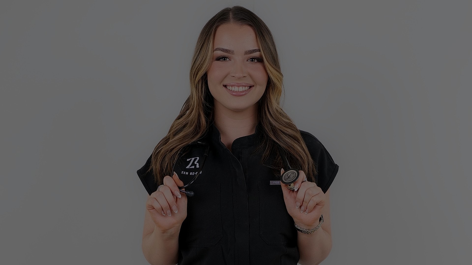 Smiling professional holding medical equipment.